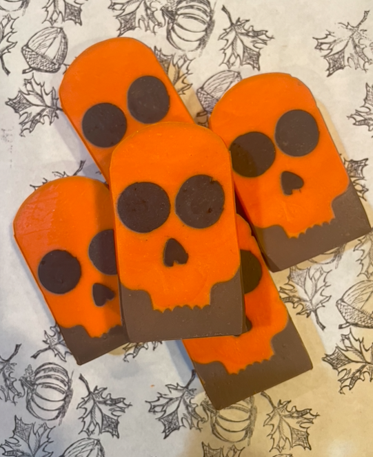 4 pieces of soap that look like orange skulls