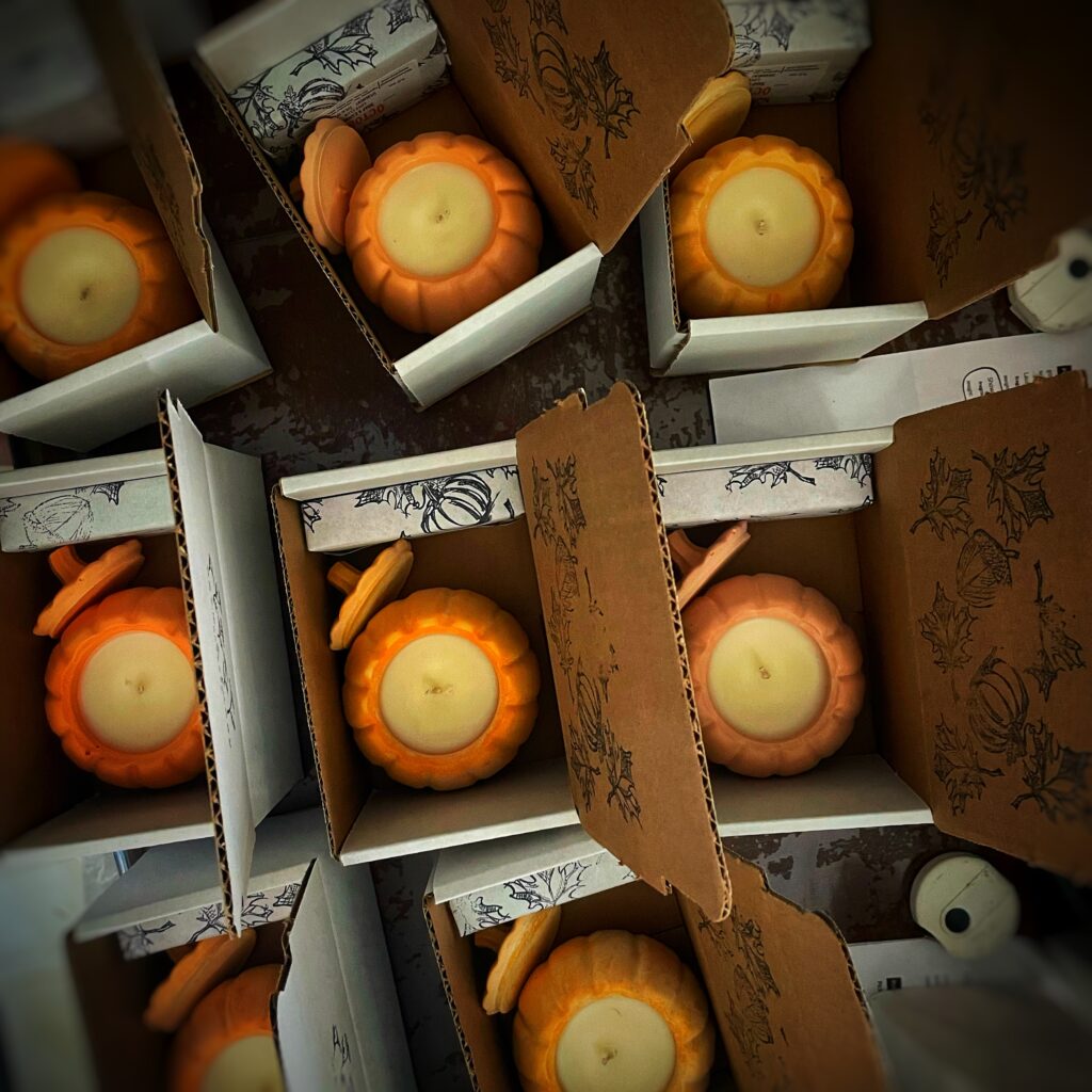 over head view of candles and soaps in boxes